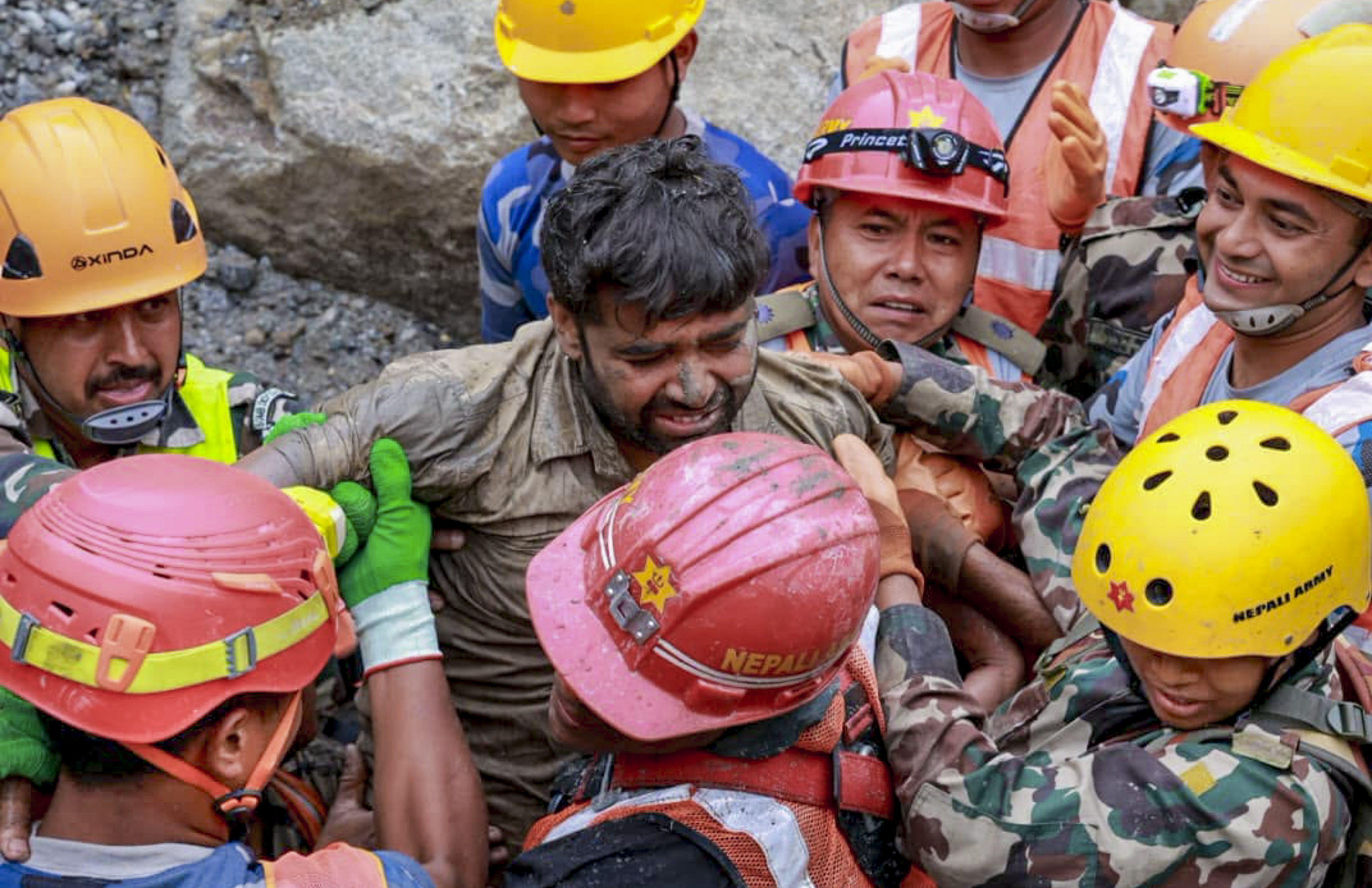 **EDS: THIRD PARTY IMAGE** In this image posted on Sept. 4, 2026, Personnel from a joint search and rescue team assist a trapped worker following his successful rescue from a tunnel of the Trishuli 3A Hydropower Project, in Rasuwa district, Nepal. Two workers trapped inside the tunnel since the catastrophic flash flood on Aug. 26 were safely brought out. (@NDRRMA_Nepal/X via PTI Photo)(PTI09_04_2026_000203B)