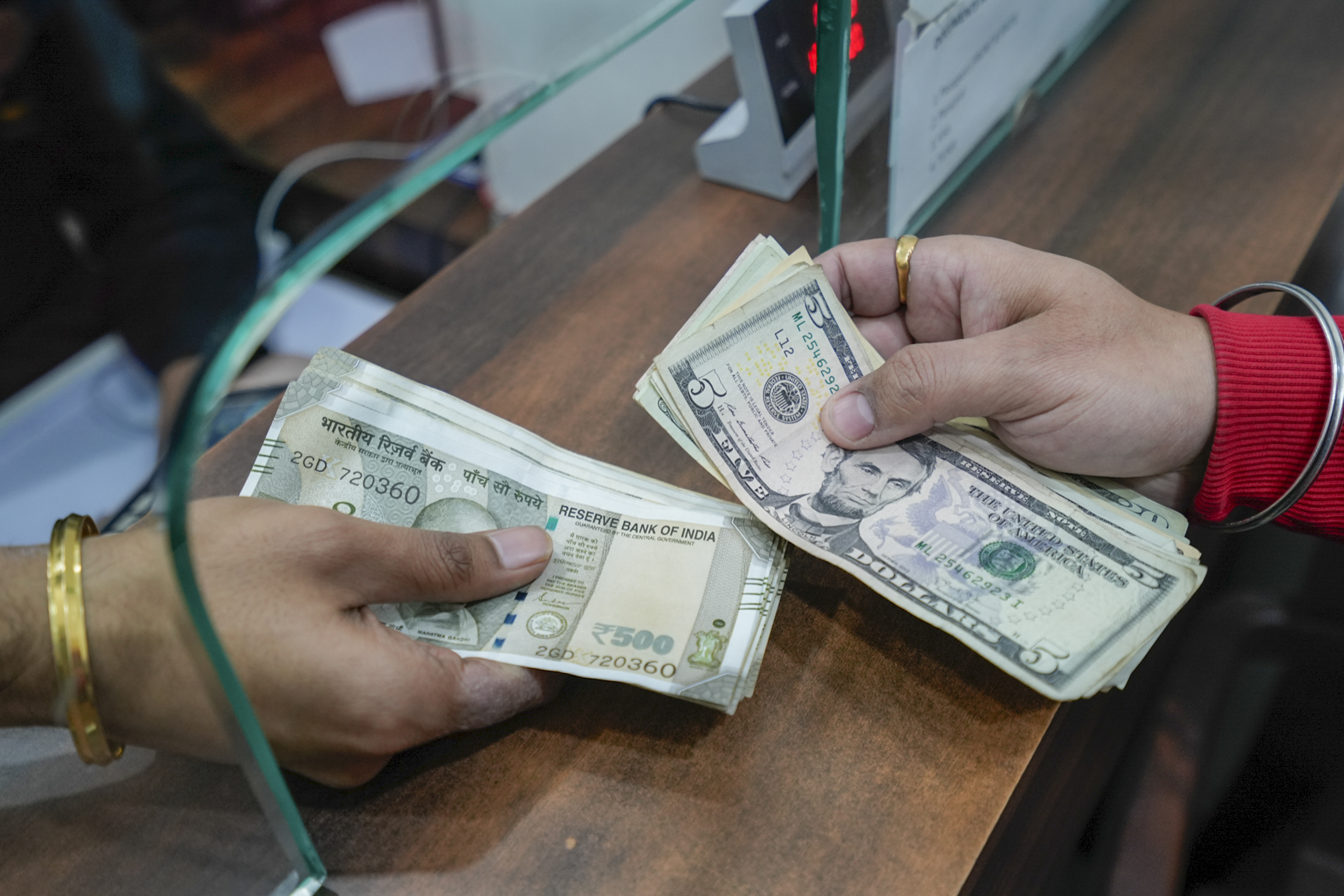 Rupee slides by 49p to end at record low of 87.11 against dollar on tariff war